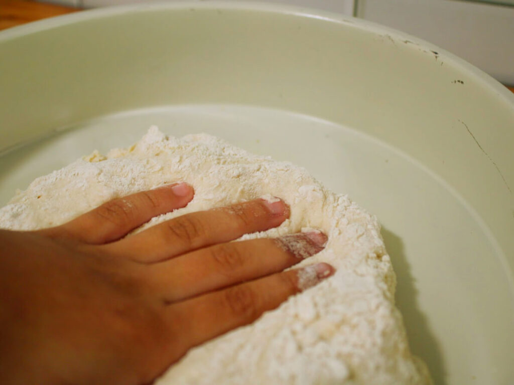kneading the pizza dough