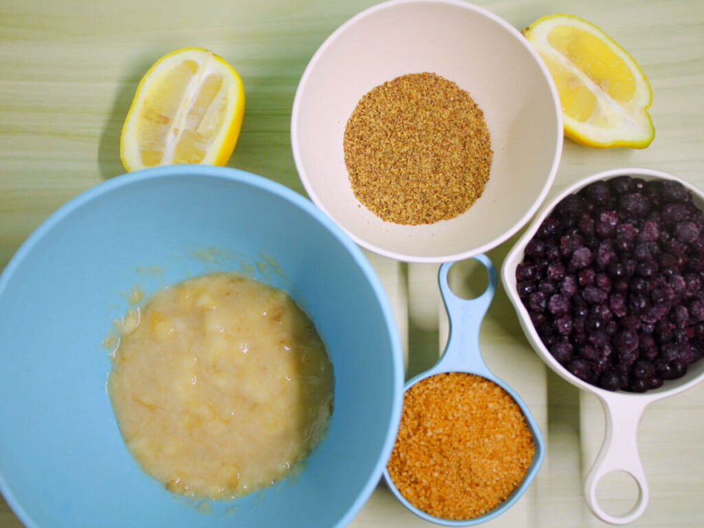 Ingredients for vegan blueberry lemon loaf on kitchen counter