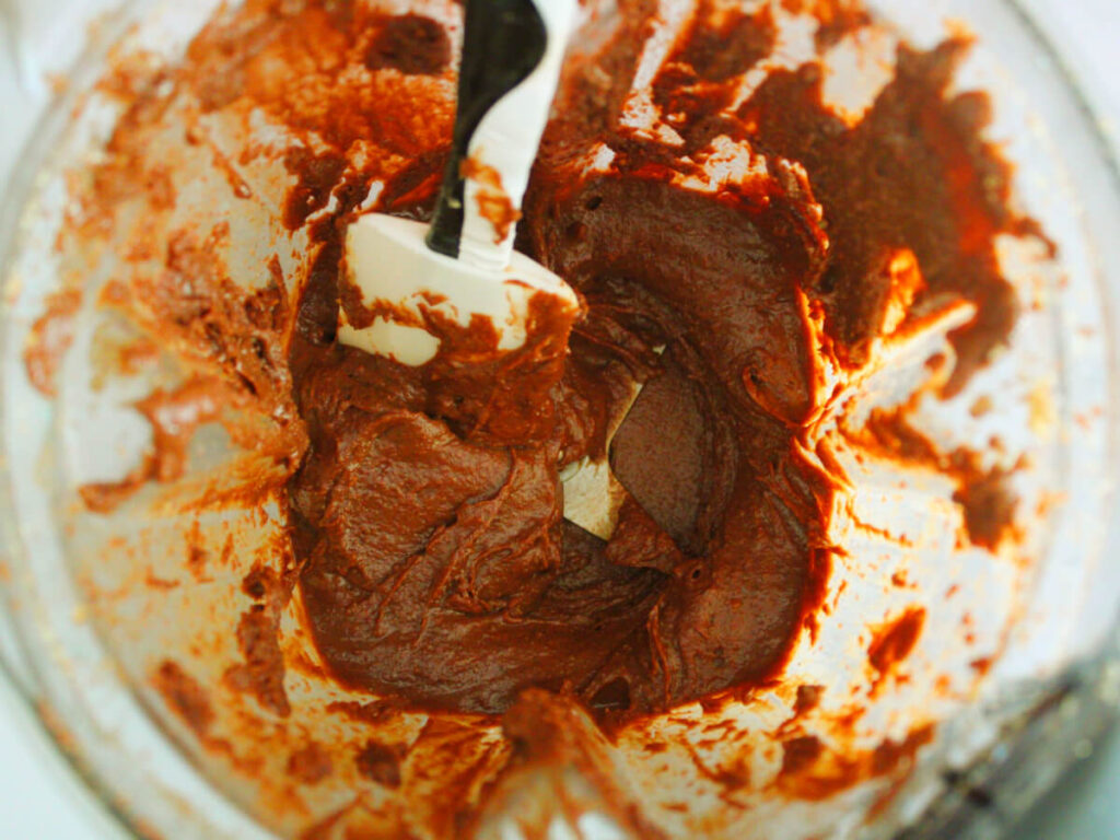 Creamy Vegan Chocolate Hazelnut Spread blended with ingredients 