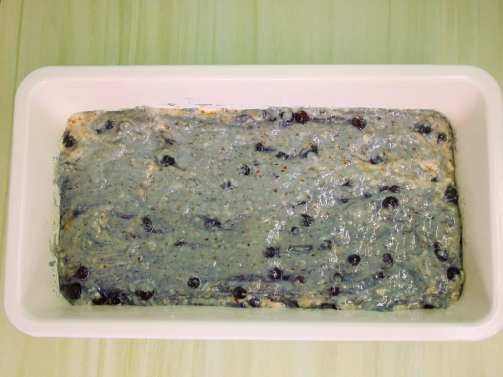 Vegan blueberry lemon loaf batter in baking pan before baking