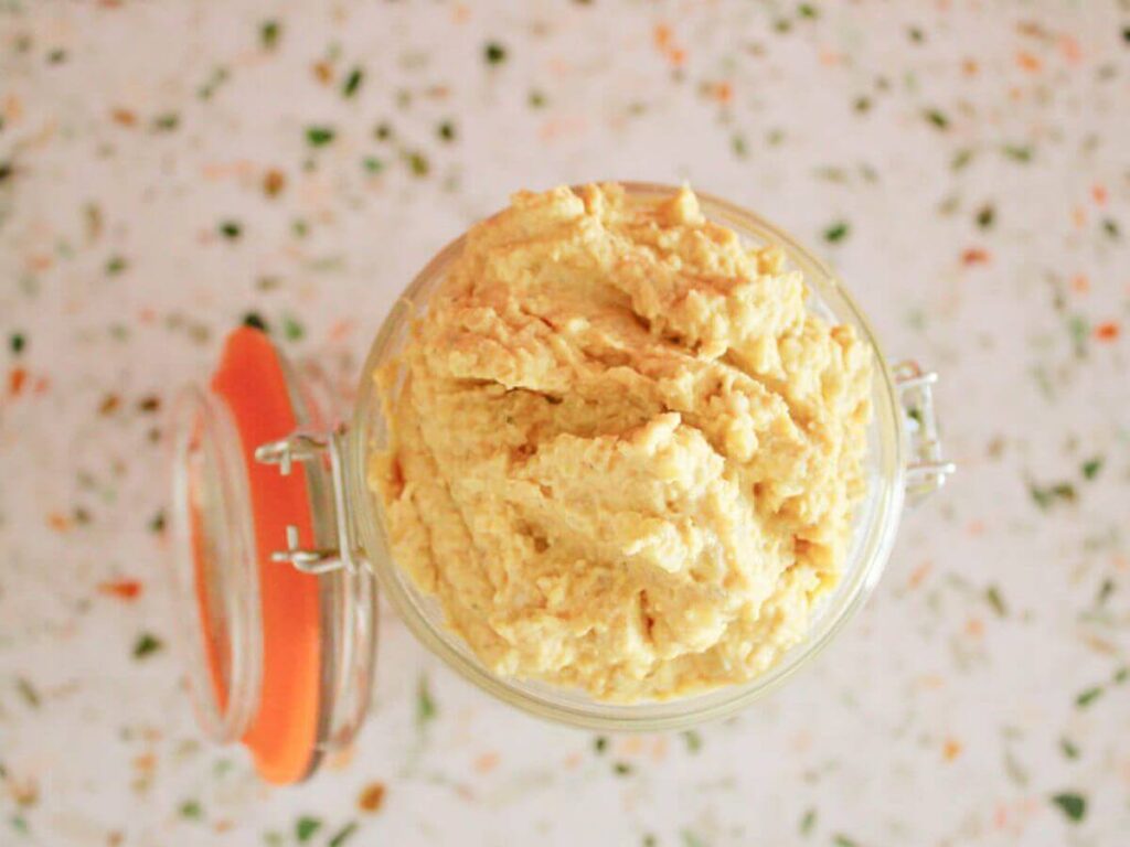 Overhead view of vegan ricotta in a glass jar