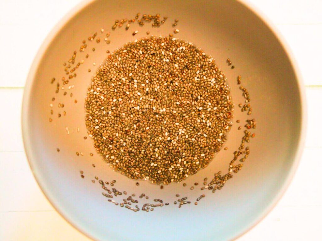 Chia seeds mixed with water forming a chia egg