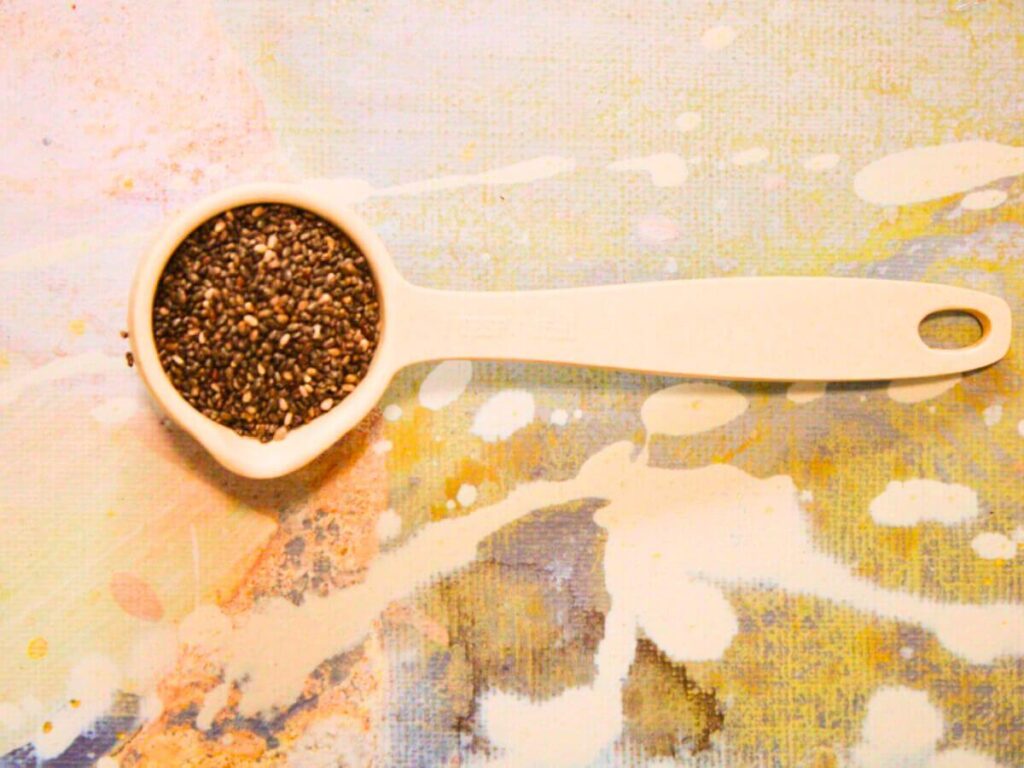 Tablespoon of chia seeds used for vegan chia pancakes