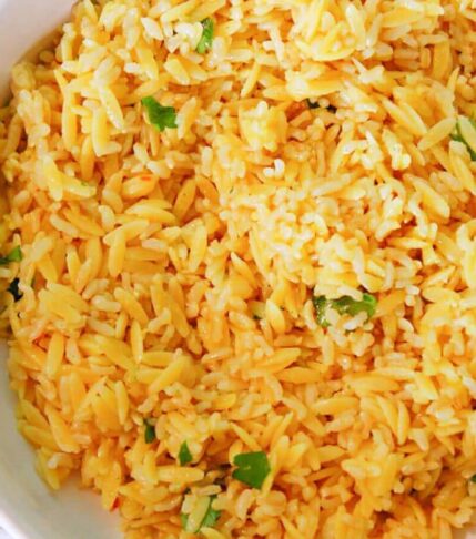 large bowl of homemade rice a roni copycat with fresh parsley