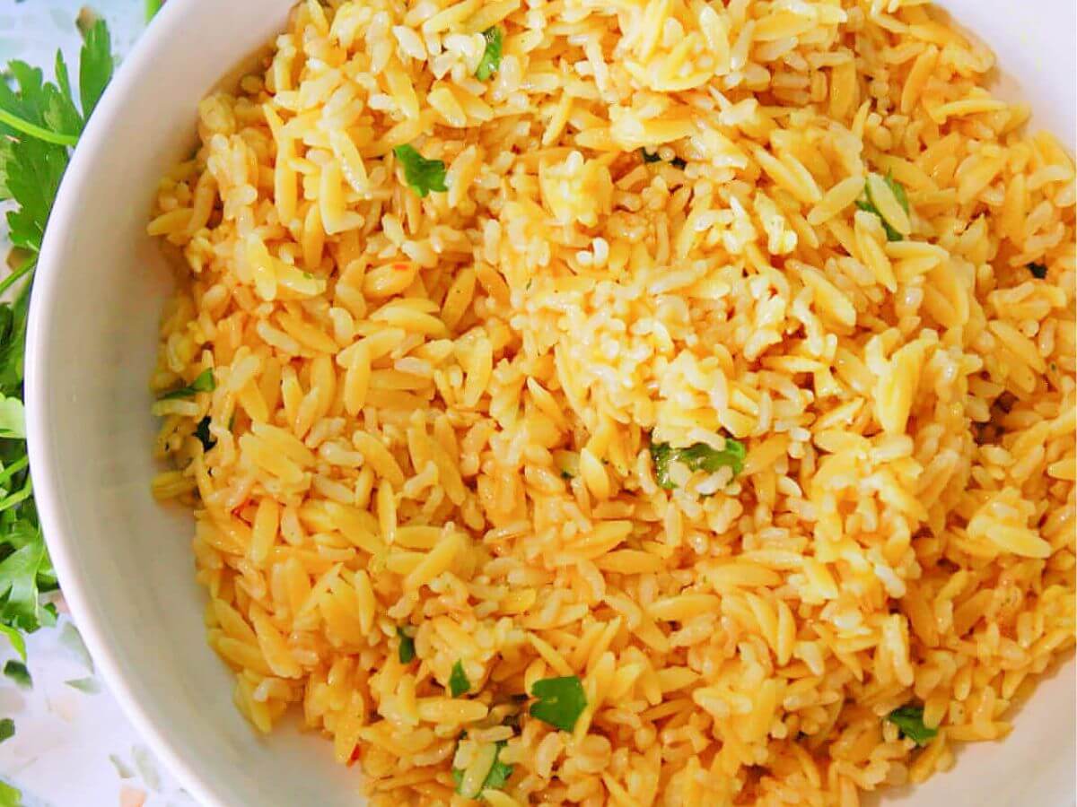 large bowl of homemade rice a roni copycat with fresh parsley