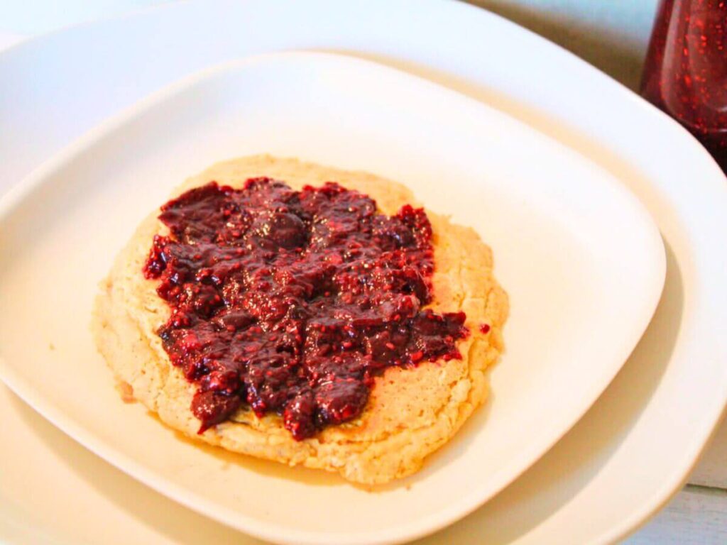 Vegan chia seed pancake topped with fruit jam