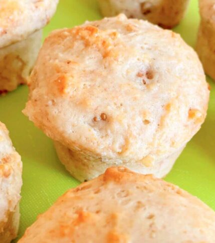 Overhead side view of golden vegan banana walnut muffins on a tray