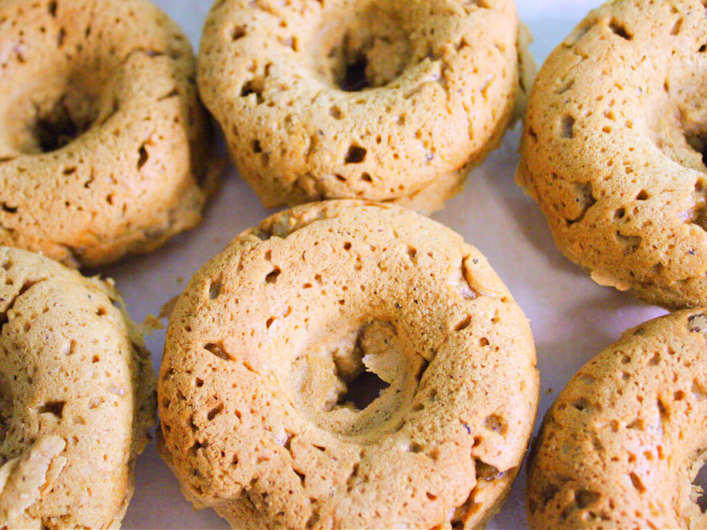 Soft vegan chestnut donuts with warm fall spices, fresh from the oven.
