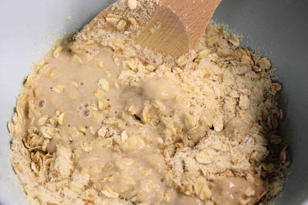 Mixing dry and wet ingredients for banana bread breakfast cookies