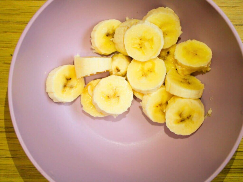Bowl of sliced ripe bananas for vegan banana bread recipe