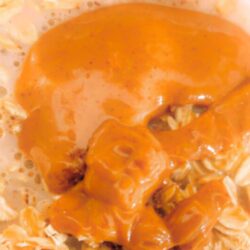 Overhead view of creamy vegan peanut butter overnight oats with peanut butter swirled on top