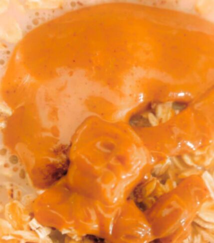 Overhead view of creamy vegan peanut butter overnight oats with peanut butter swirled on top