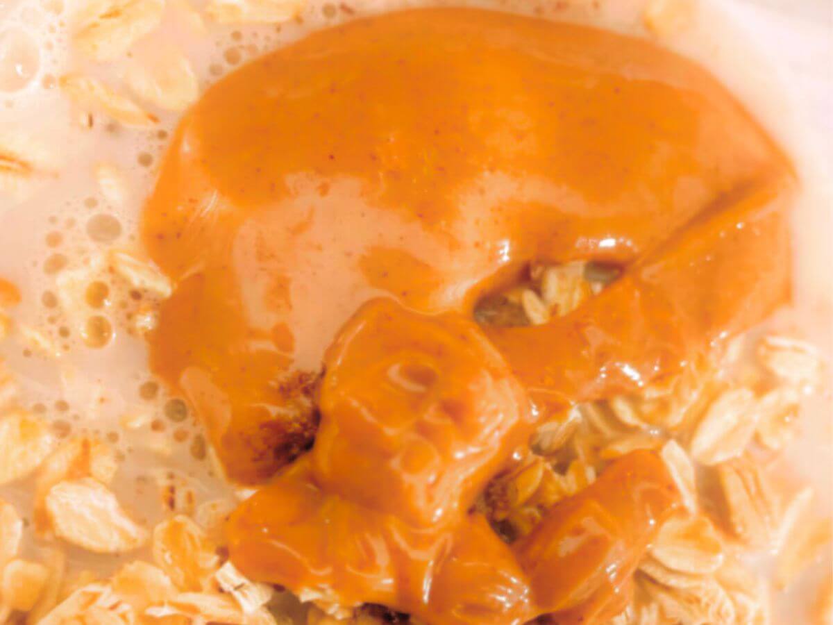 Overhead view of creamy vegan peanut butter overnight oats with peanut butter swirled on top
