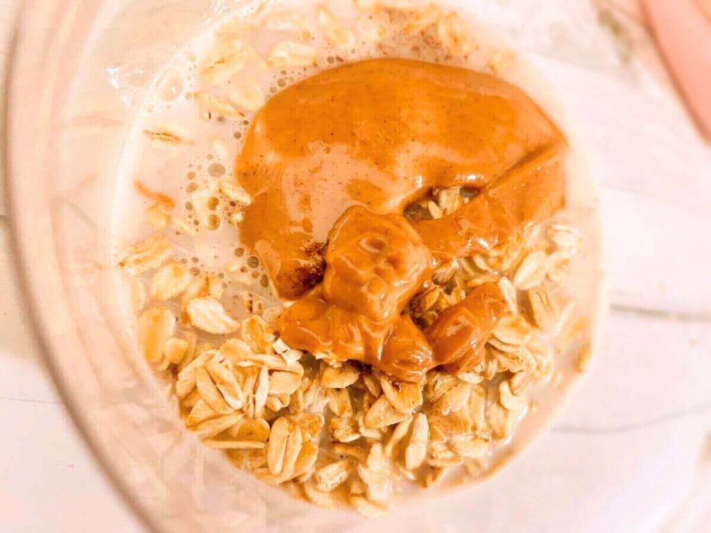 Overhead view of vegan peanut butter overnight oats with a peanut butter swirl on top