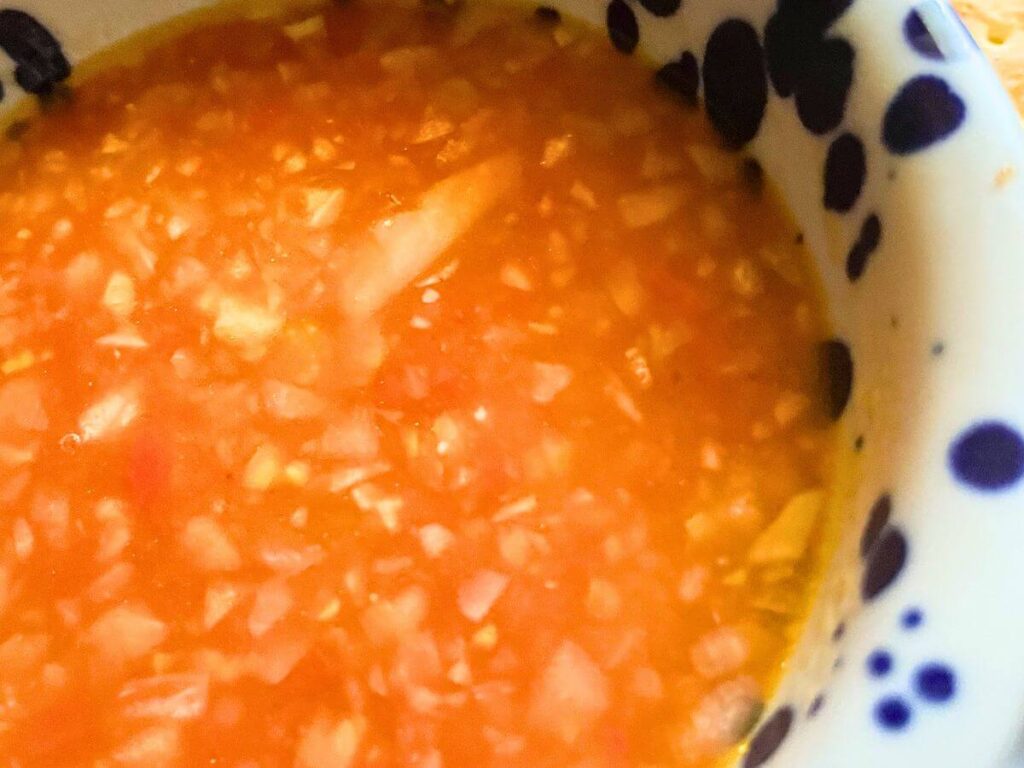 vegan tomato rice soup with rice in bowl
