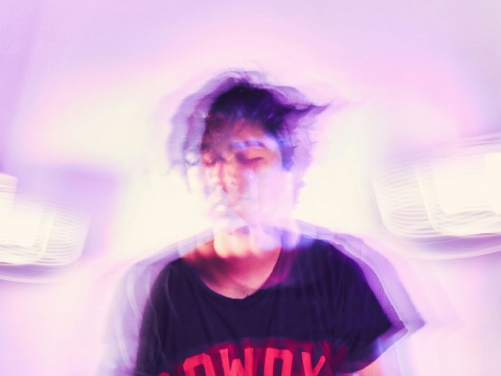 Blurred image of a child with ADHD pacing and struggling to wait in a public space, capturing restlessness and difficulty with transitions.