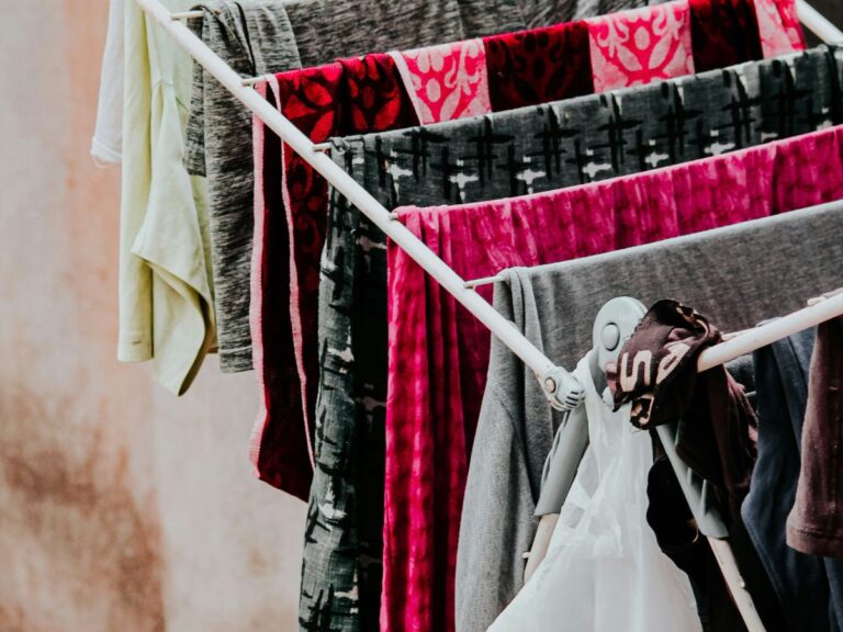 Clothes drying on a rack in natural light, reflecting simple, everyday modern homesteading at home.