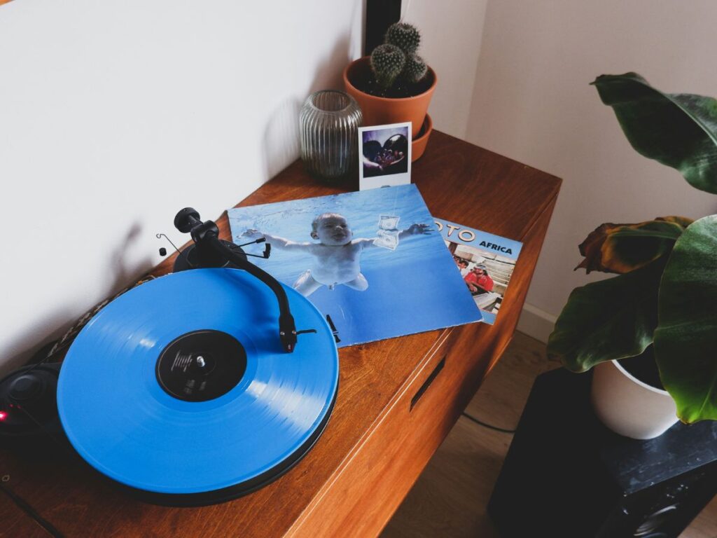 Overhead view of a desk with a Nirvana vinyl record on it