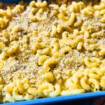 Close-up of vegan baked mac and cheese showing a creamy texture and soft pasta