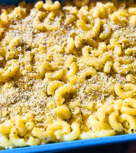 Close-up of vegan baked mac and cheese showing a creamy texture and soft pasta