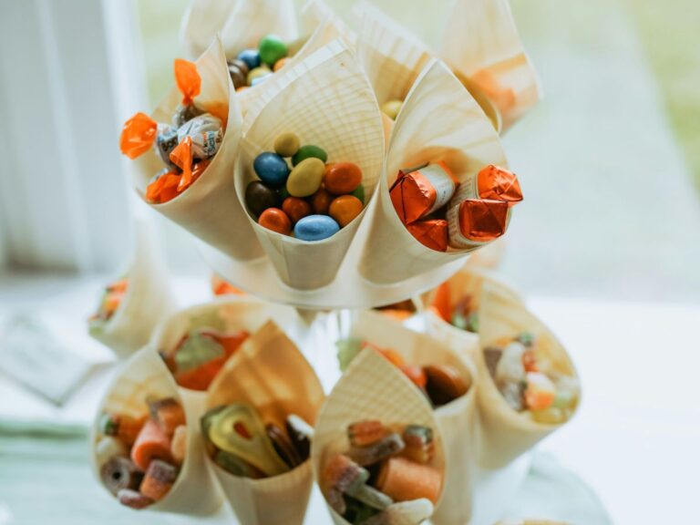 Colorful candy and snack cones arranged like a bouquet, showing how presentation and marketing influence food appeal for kids